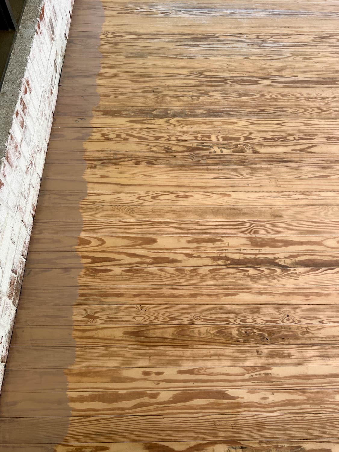brushing behr stain color taupe on old deck wood