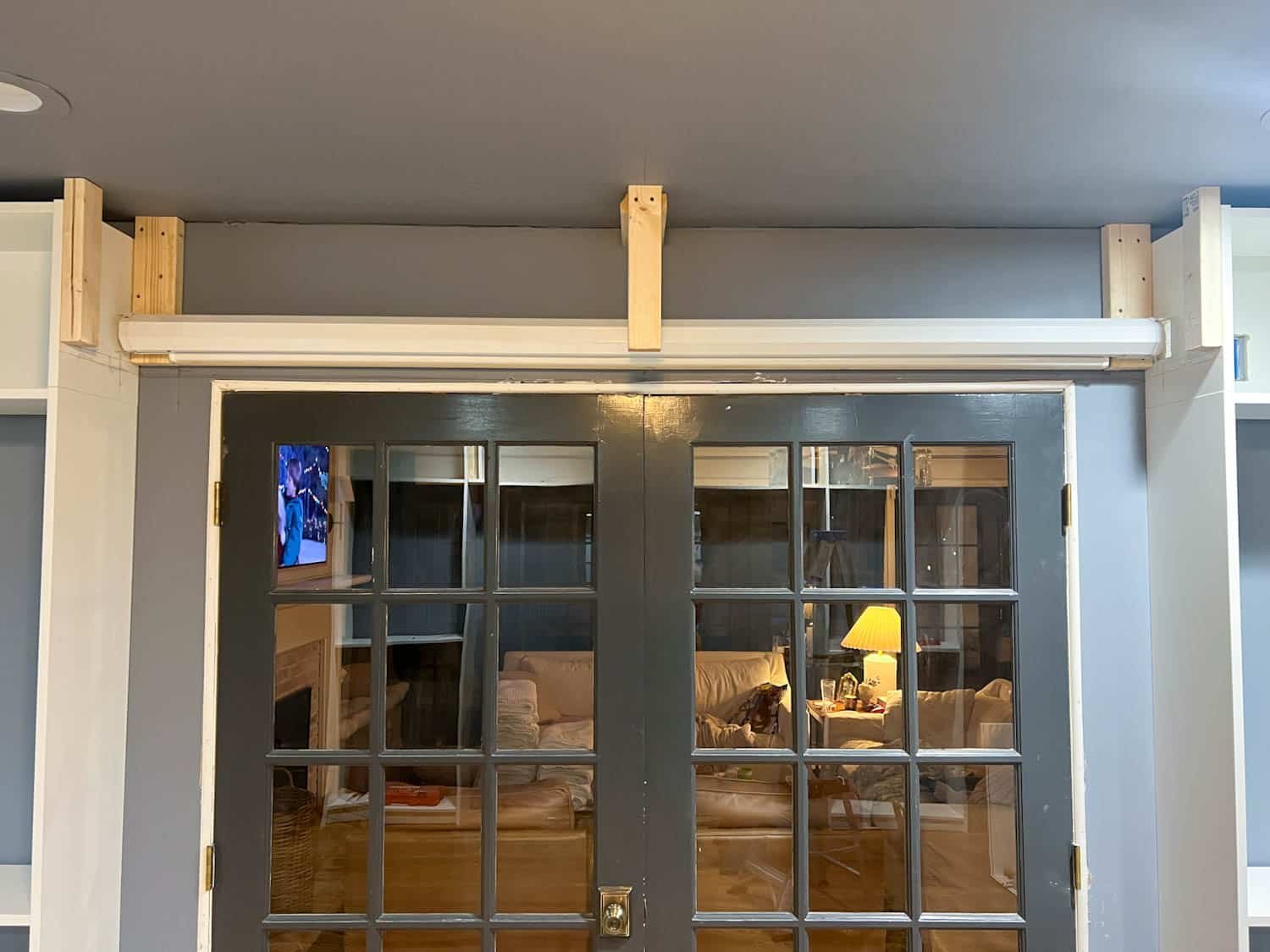 anchoring box to studs between bookcases