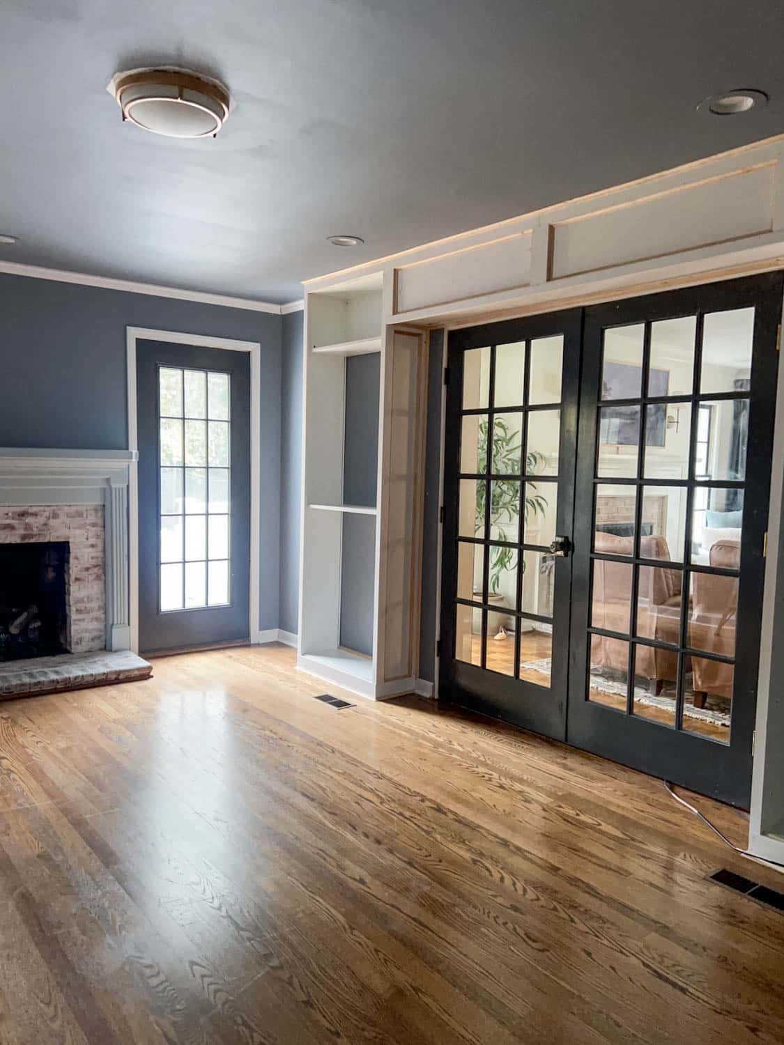 French doors surrounded by built in bookcases