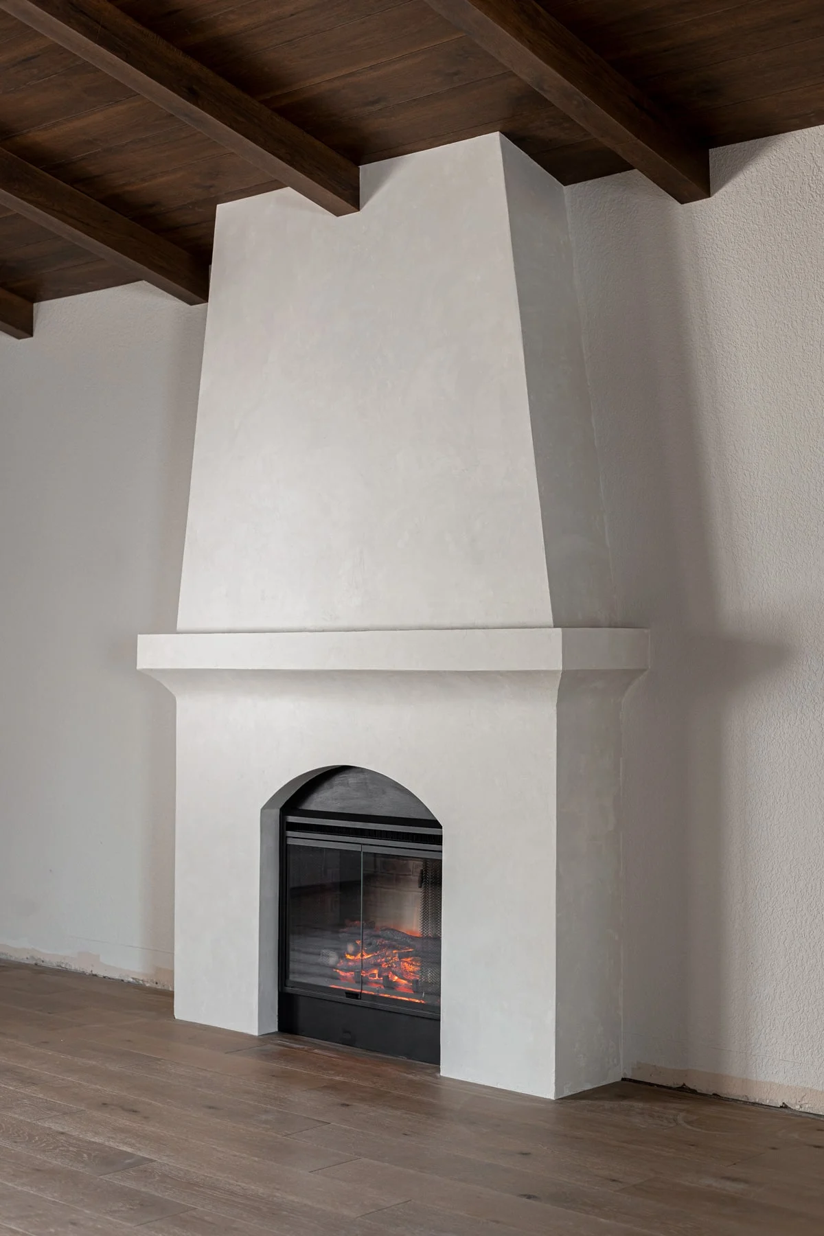 diy built-in electric fireplace with venetian plaster