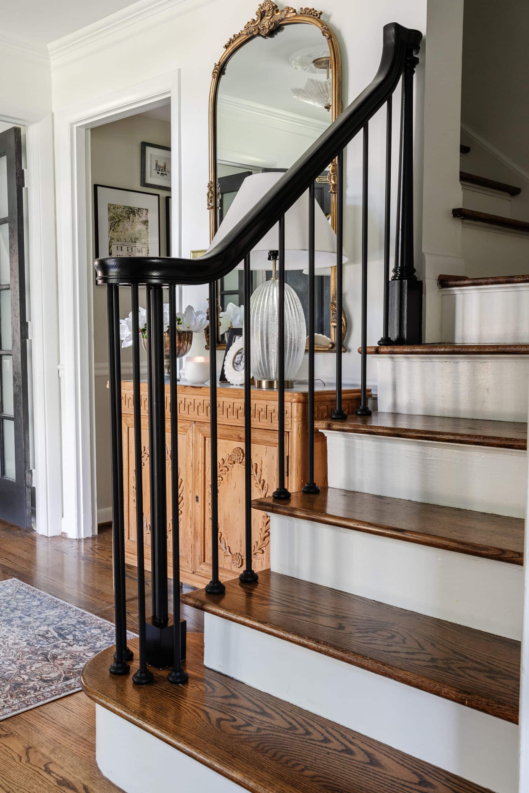 newly replaced stair spindles on a stair railing