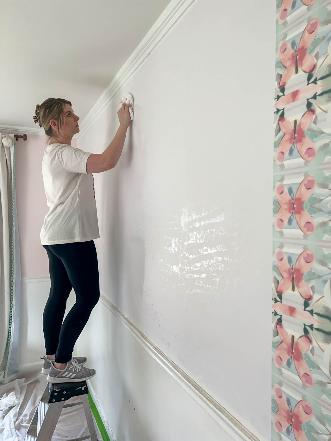 cleaning adhesive off of wall after wallpaper stripping