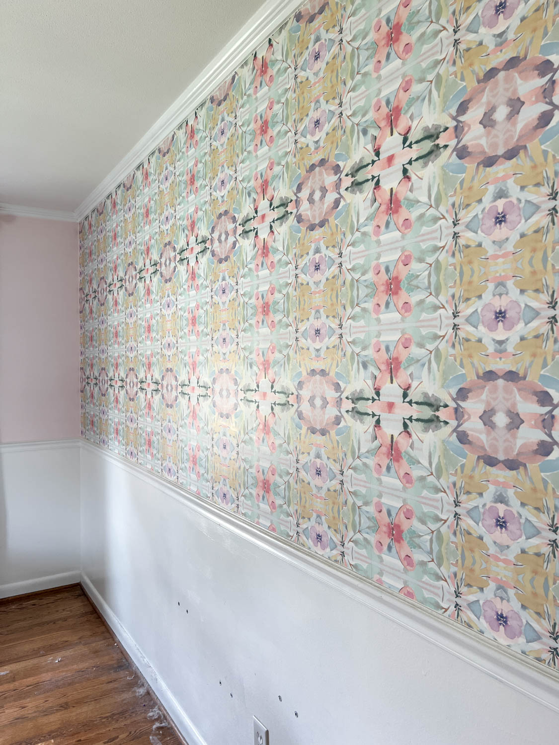pasted wallpaper on a wall in a bedroom