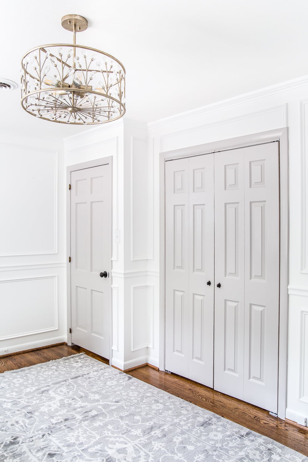 gray painted interior doors with white walls in a nursery