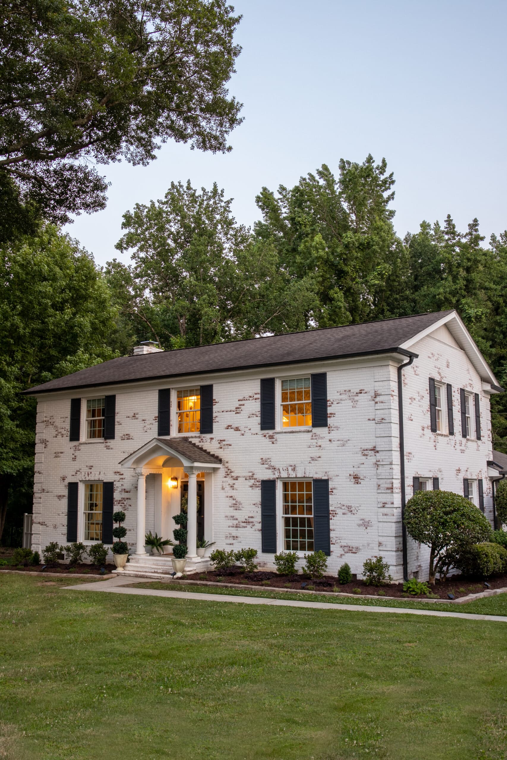 limewashed brick colonial house with Romabio limewash