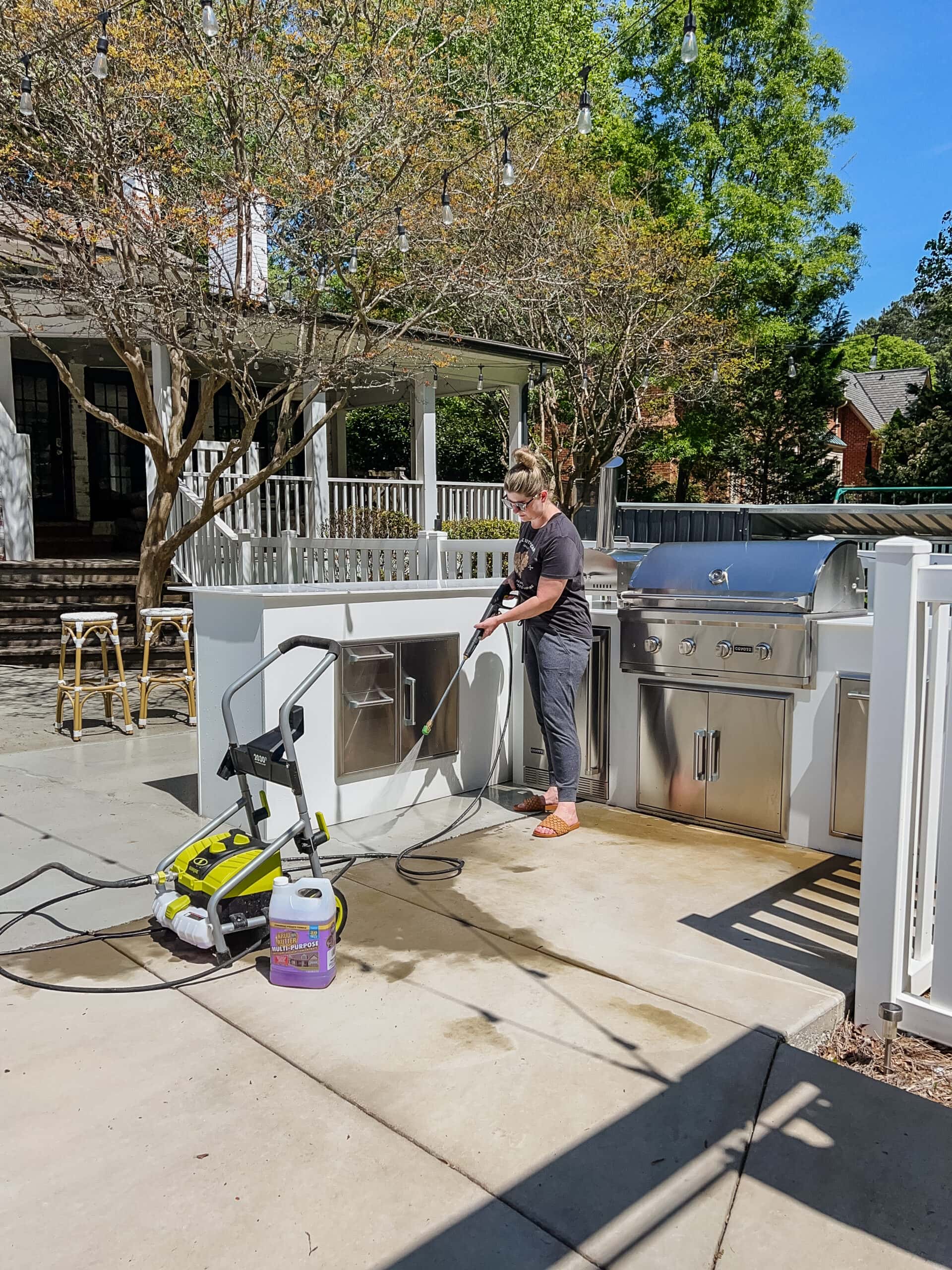 pressure washer cleaning an outdoor kitchen