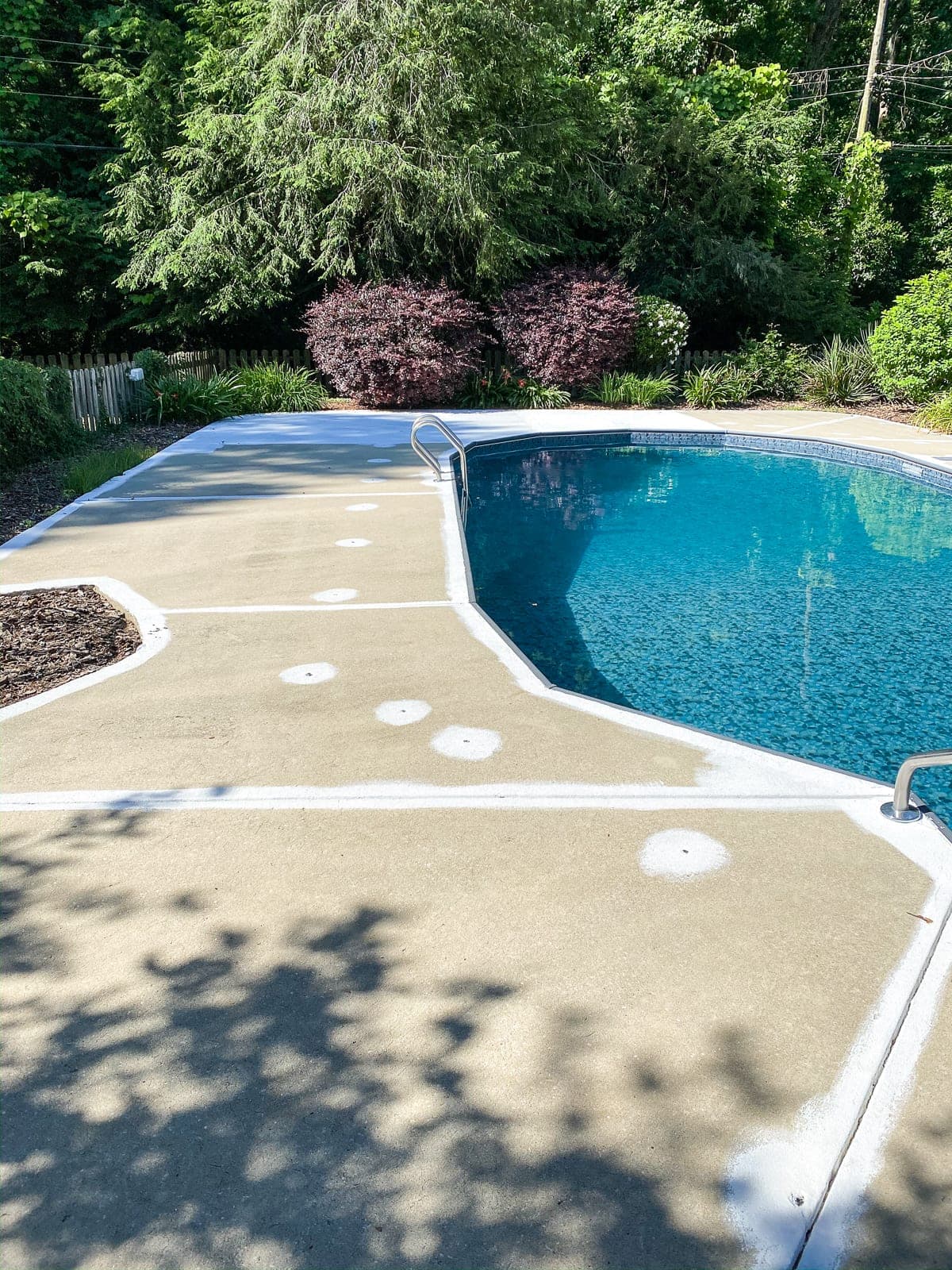 badly painted concrete pool deck