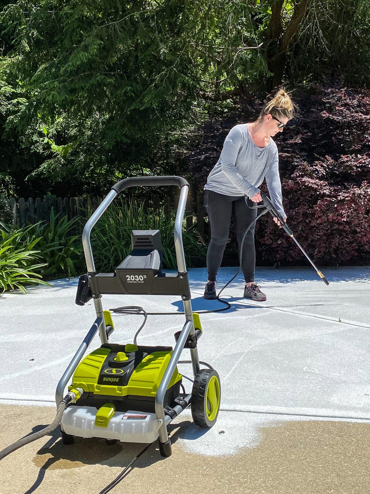 power washing concrete before painting around a pool