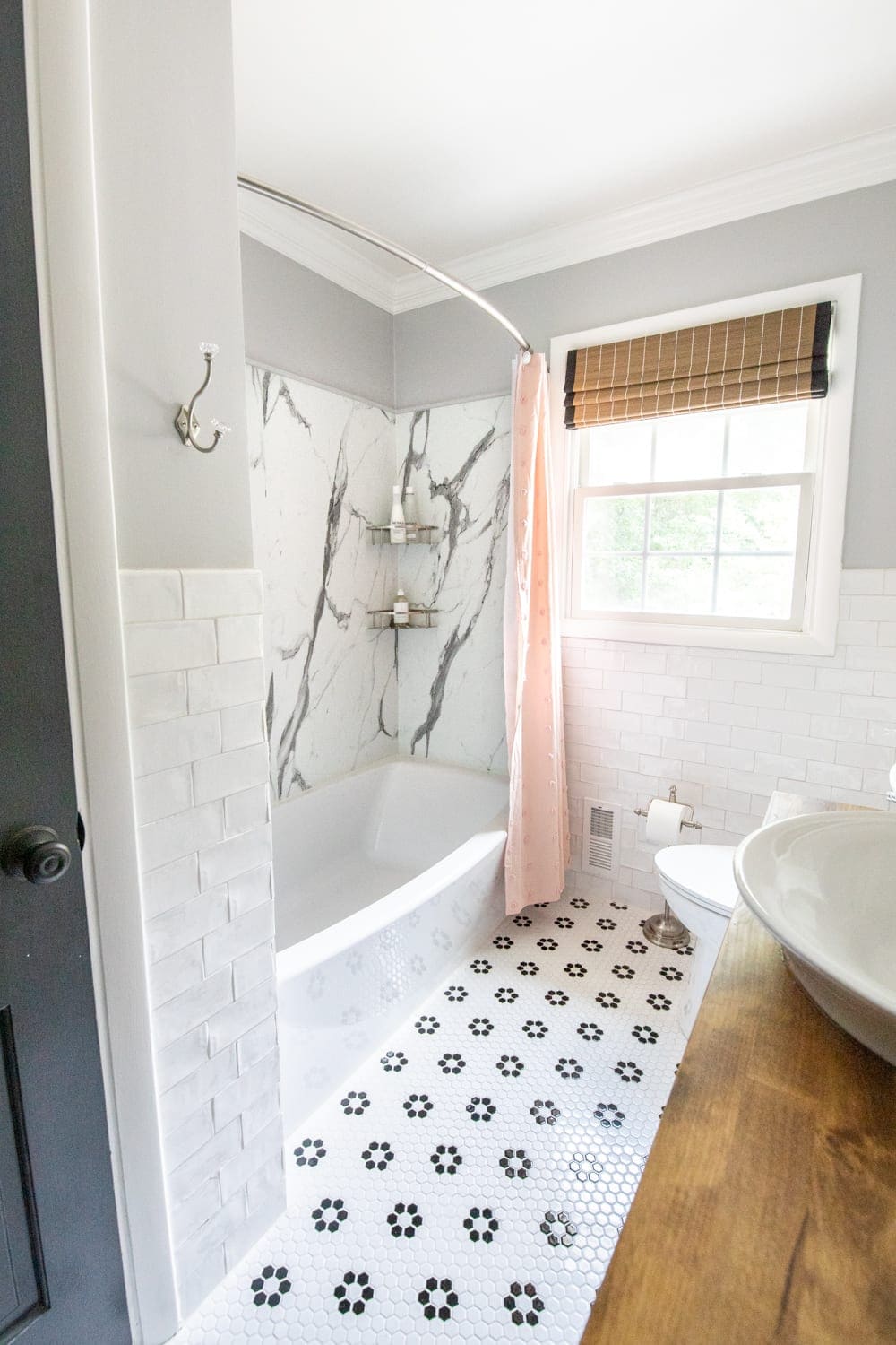 girls bathroom with pink shower curtain