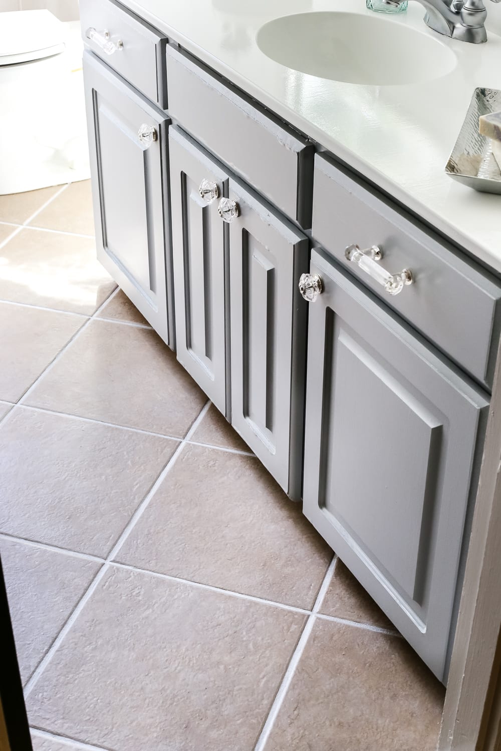 white tile grout with grout pen in a bathroom